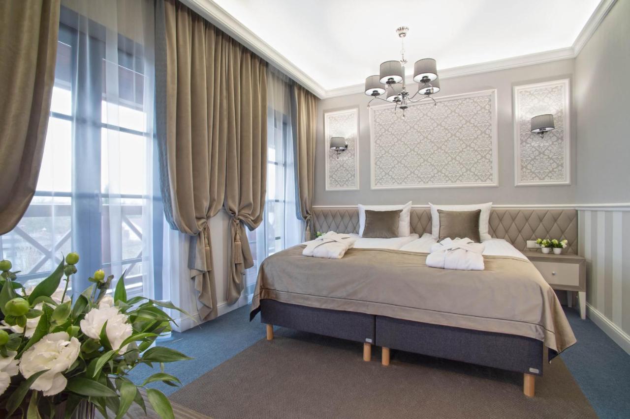 Boutique Odyseja & Spa Ciechocinek Exterior foto A bedroom in the hotel