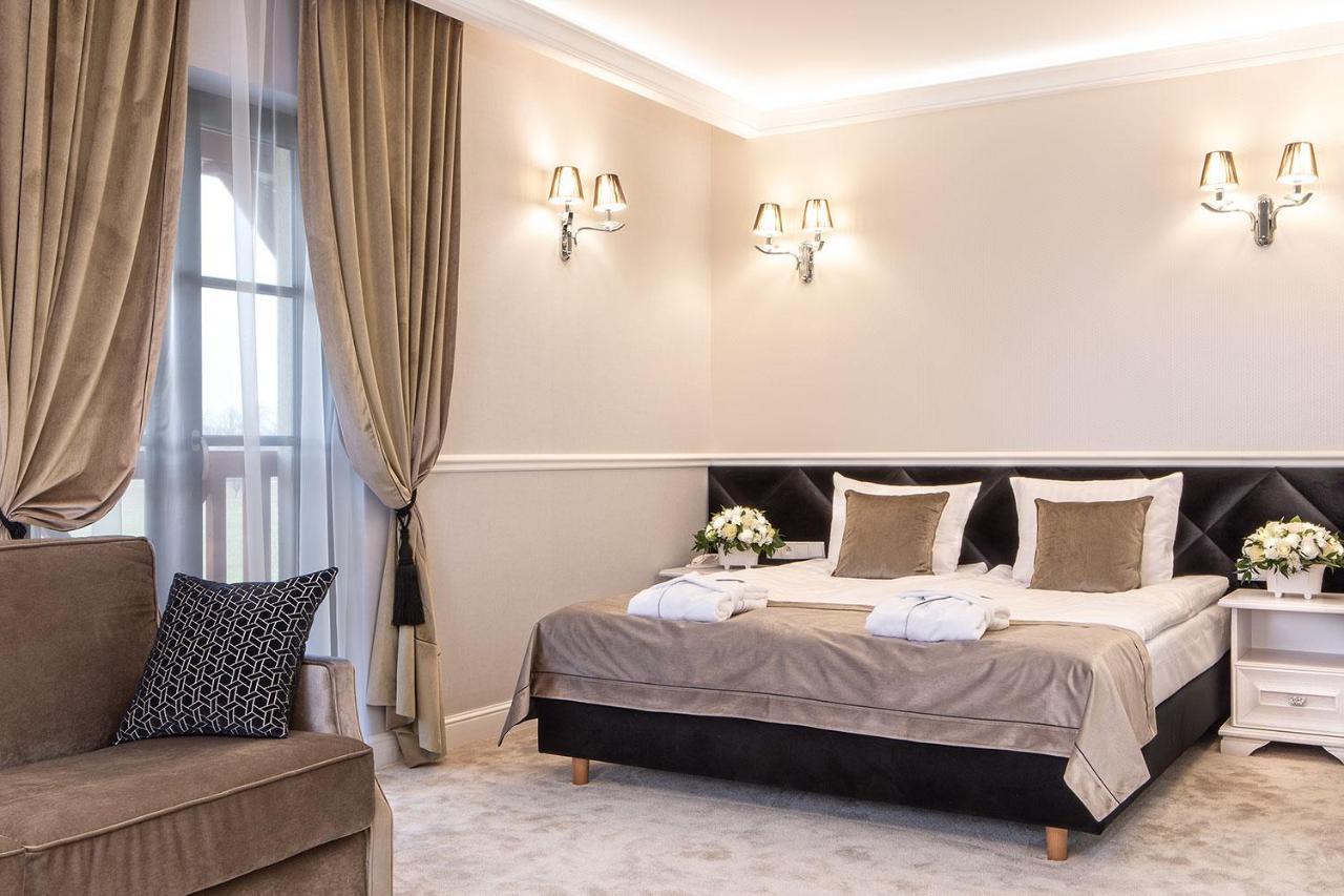 Boutique Odyseja & Spa Ciechocinek Exterior foto A bedroom at the hotel